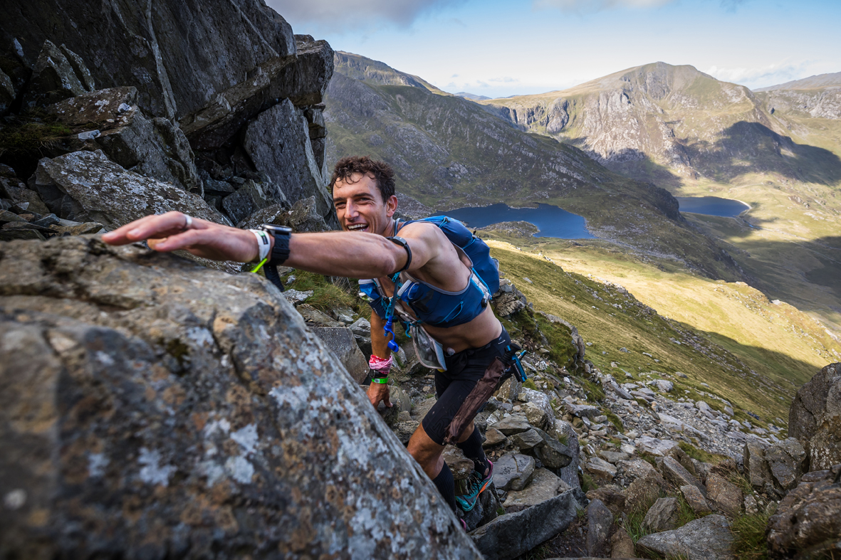 Race leader Chris Cope scrambles up Tryfan at the 2022 Montane Dragons Back Race No Limits Photography