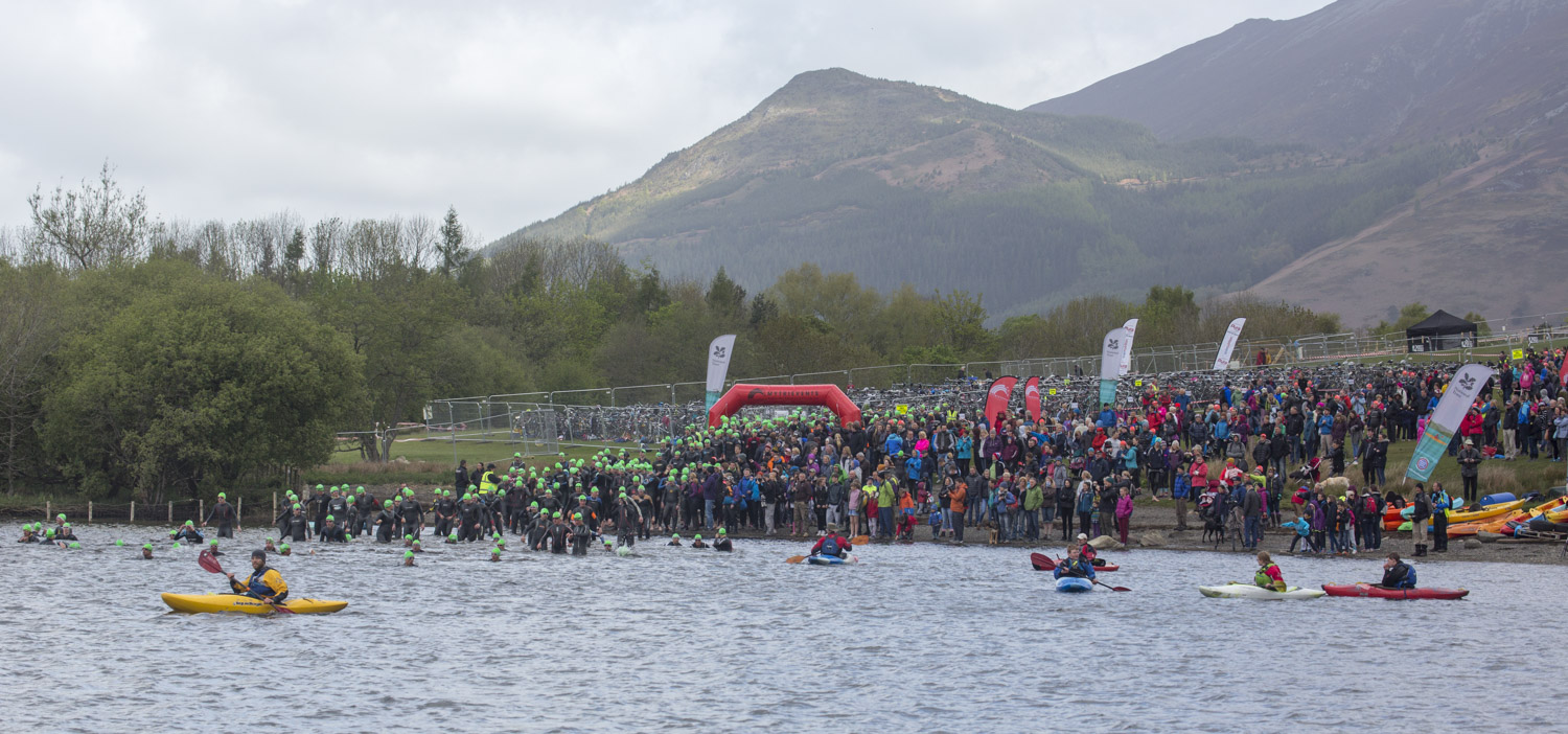 Open water swimmers enter the water at Keswick Mountain Festival